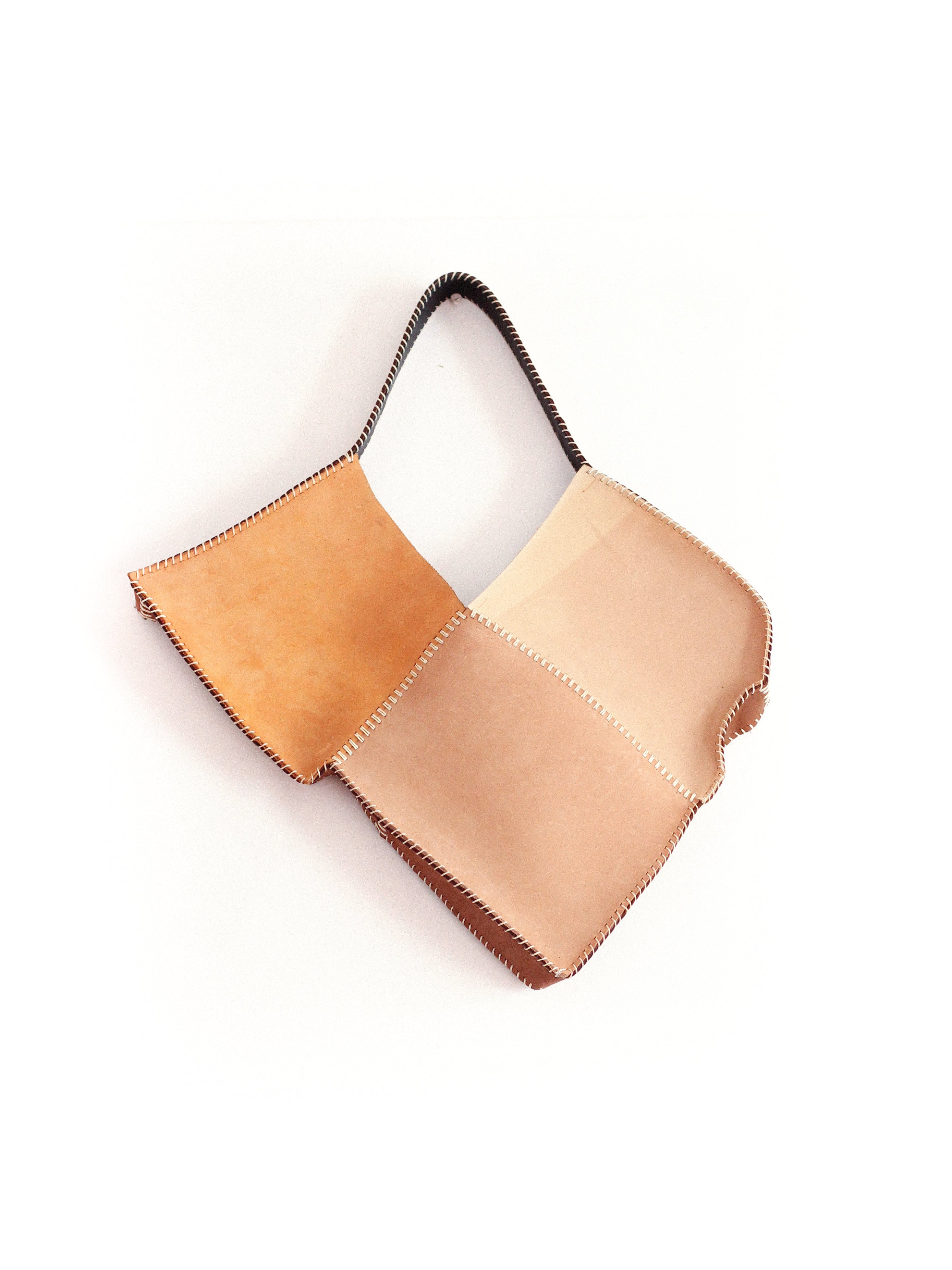 the beige broken heart leather bag
