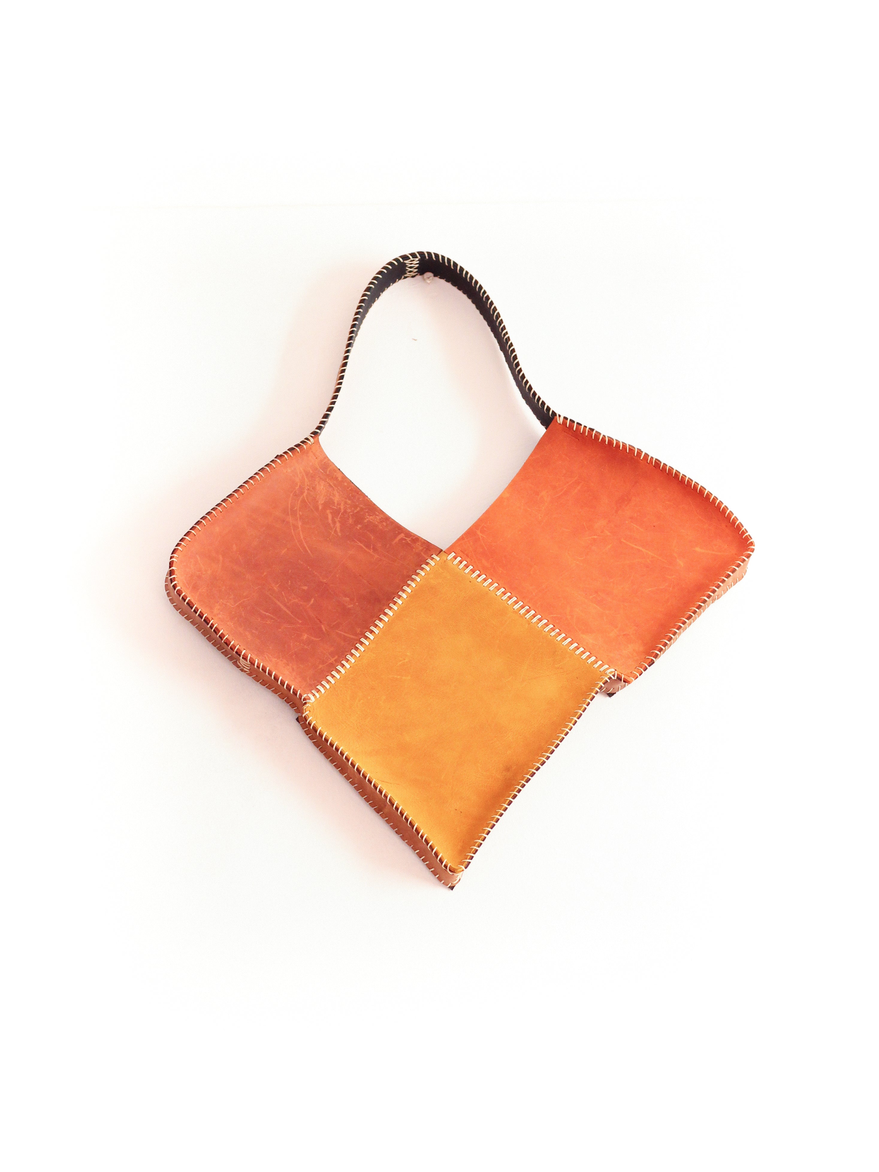 the orange broken heart leather bag