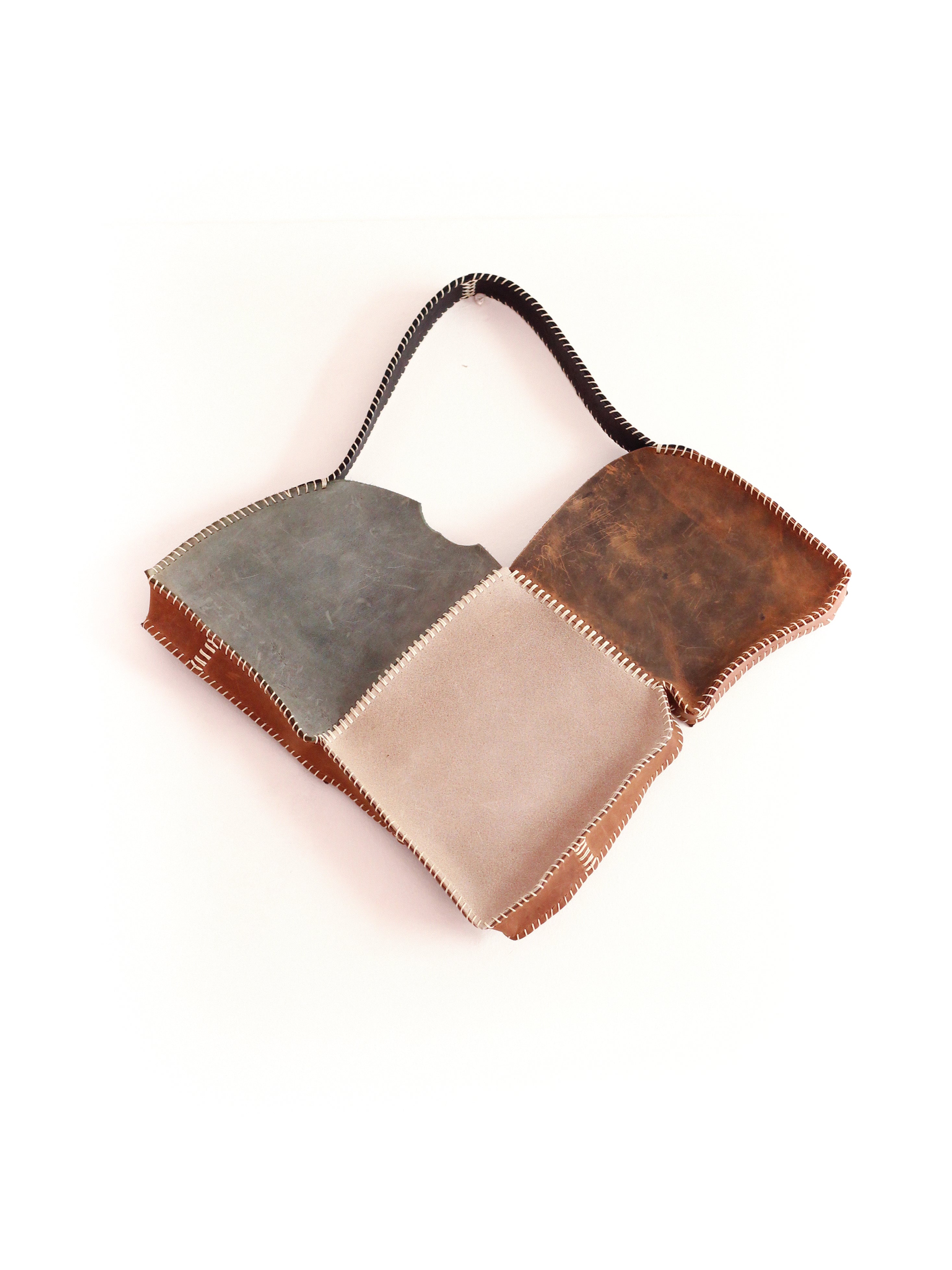 the green and brown broken heart leather bag